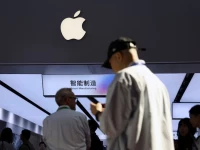 people walk past a booth showcasing apple s suppliers during the china international supply chain expo cisce in beijing china june 22 2026 photo reuters file