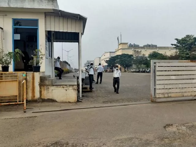 private security guards stand at the entrance of a closed plant of foxconn india which makes iphones for apple inc near chennai india on dec 22 photo reuters file private security guards stand at the entrance of a closed plant of foxconn india which makes iphones for apple inc near chennai india on dec 22 photo reuters file