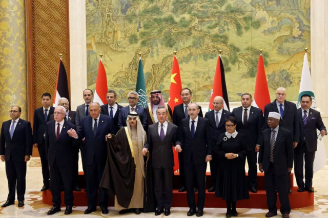 chinese foreign minister wang yi attends a family photo session with saudi foreign minister prince faisal bin farhan al saud jordanian deputy prime minister and foreign minister ayman safadi egyptian foreign minister sameh shoukry indonesian foreign minister retno marsudi palestinian foreign minister riyad al maliki and organisation of islamic cooperation oic secretary general hissein brahim taha at the diaoyutai state guesthouse in beijing china november 20 2023 reuters florence lo pool chinese foreign minister wang yi attends a family photo session with saudi foreign minister prince faisal bin farhan al saud jordanian deputy prime minister and foreign minister ayman safadi egyptian foreign minister sameh shoukry indonesian foreign minister retno marsudi palestinian foreign minister riyad al maliki and organisation of islamic cooperation oic secretary general hissein brahim taha at the diaoyutai state guesthouse in beijing china november 20 2023 reuters florence lo pool