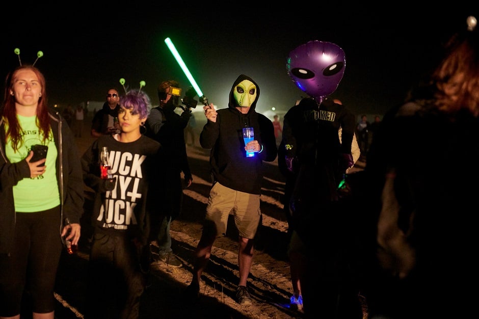 Attendees listen to music during Alienstock festival on the 