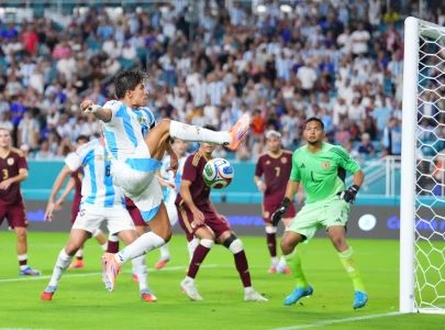messi less argentina down venezuela in friendly