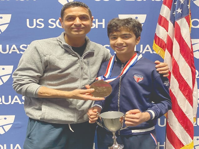 pak american rising star armaan burhan is seen with his coach faheem khan after his achievement in prestigious us squash event photo psa