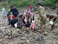 this handout photograph released on july 22 2025 by government of gilgit baltistan shows pakistan s army soldiers helping visitors to evacuate the landslide hit area in babusar g b photo afp this handout photograph released on july 22 2025 by government of gilgit baltistan shows pakistan s army soldiers helping visitors to evacuate the landslide hit area in babusar g b photo afp