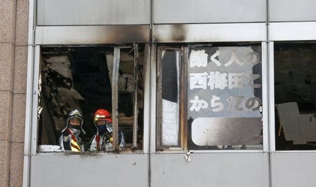 firefighters are seen at a building where a fire broke out in osaka western japan december 17 2021 in this photo taken by kyodo kyodo via reuters firefighters are seen at a building where a fire broke out in osaka western japan december 17 2021 in this photo taken by kyodo kyodo via reuters