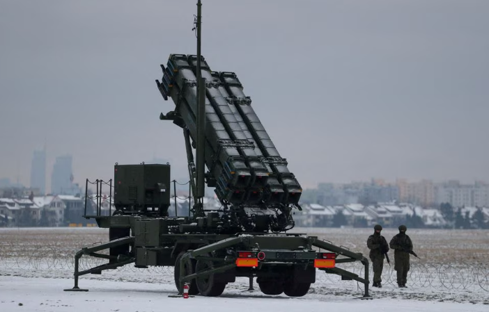 servicemen patrol in front of the patriot air defence system during polish military training on the missile systems at the airport in warsaw poland february 7 2023 reuters kacper pempel file photo acquire licensing rights