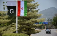 iranian and pakistani national flags are displayed along a street ahead of the arrival of iran s president masoud pezeshkian in islamabad pakistan june 23 2026 reuters