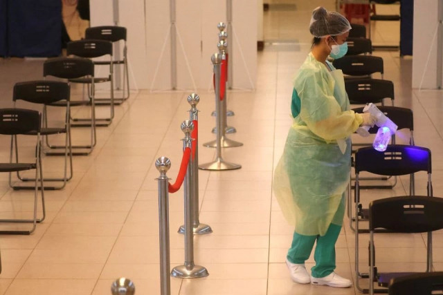 a medical worker disinfects the chairs after people received a dose of the astrazeneca vaccine against the coronavirus disease covid 19 during a vaccination session for elderly people over 75 years old at a stadium in new taipei city taiwan june 25 2021 photo reuters a medical worker disinfects the chairs after people received a dose of the astrazeneca vaccine against the coronavirus disease covid 19 during a vaccination session for elderly people over 75 years old at a stadium in new taipei city taiwan june 25 2021 photo reuters