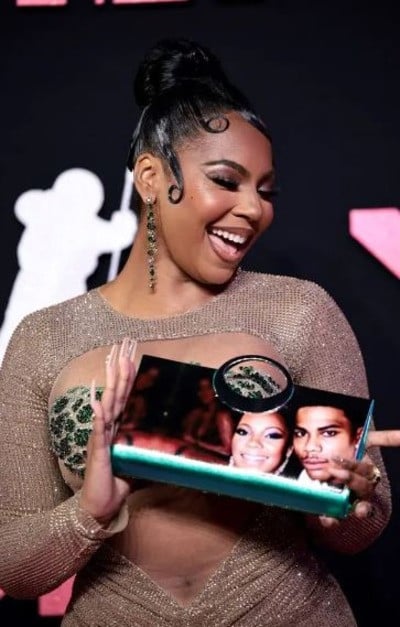 Ashanti (pictured) was also spotted carrying a clutch bag with her and Nelly’s face on it at the 2023 MTV Video Music Awards. (Image: Getty Images)