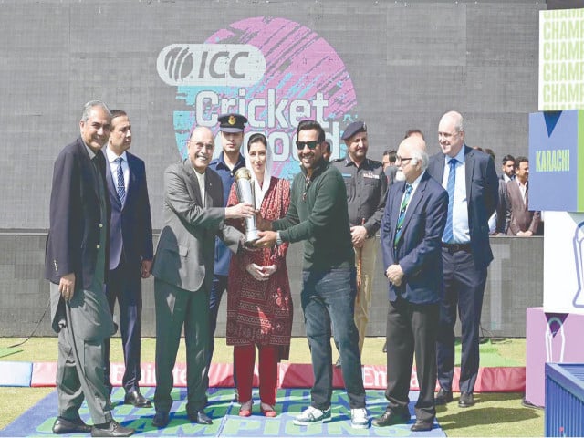 resident asif zardari and first lady aseefa bhutto zardari are presented the champions trophy by former pakistan captain sarfraz ahmad at national stadium photo app