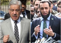 defence minister khawaja asif l and information and broadcasting minister attaullah tarar r photos file