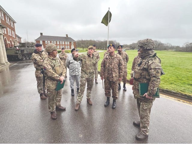 coas gen syed asim munir is being briefed by british army officers during his visit to warminster and larkhill garrisons photo ppi