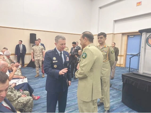 chief of army staff field marshal syed asim munir speaks with us chairman joint chiefs of staff gen dan caine during change of command ceremony of the us central command in tampa florida photo inp
