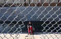 a family from columbia climbs up through a canal fence after crossing under a hole in the us mexico border wall in el paso texas photo afp
