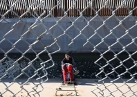 a family from columbia climbs up through a canal fence after crossing under a hole in the us mexico border wall in el paso texas photo afp