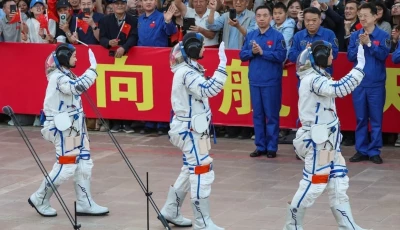 astronauts zhu yangzhu zhang zhiyuan and lai ka ying who is the first astronaut from hong kong wave during a see off ceremony before taking part in the shenzhou 23 spaceflight mission to china s tiangong space station at jiuquan satellite launch center near jiuquan gansu province china may 24 2026 reuters