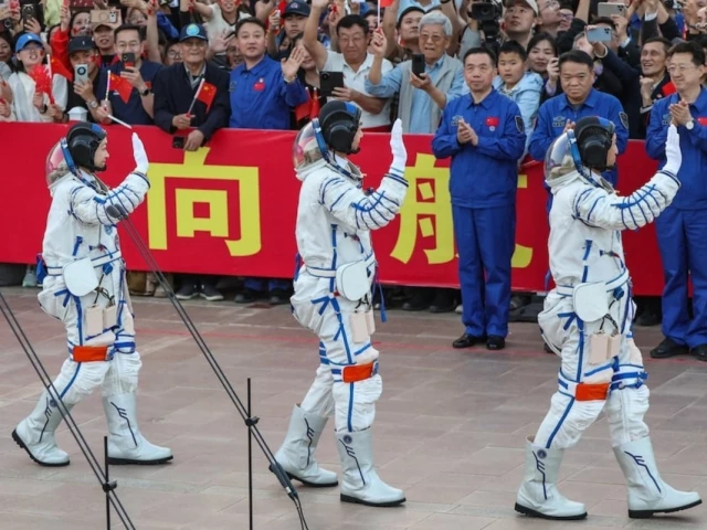 astronauts zhu yangzhu zhang zhiyuan and lai ka ying who is the first astronaut from hong kong wave during a see off ceremony before taking part in the shenzhou 23 spaceflight mission to china s tiangong space station at jiuquan satellite launch center near jiuquan gansu province china may 24 2026 reuters astronauts zhu yangzhu zhang zhiyuan and lai ka ying who is the first astronaut from hong kong wave during a see off ceremony before taking part in the shenzhou 23 spaceflight mission to china s tiangong space station at jiuquan satellite launch center near jiuquan gansu province china may 24 2026 reuters
