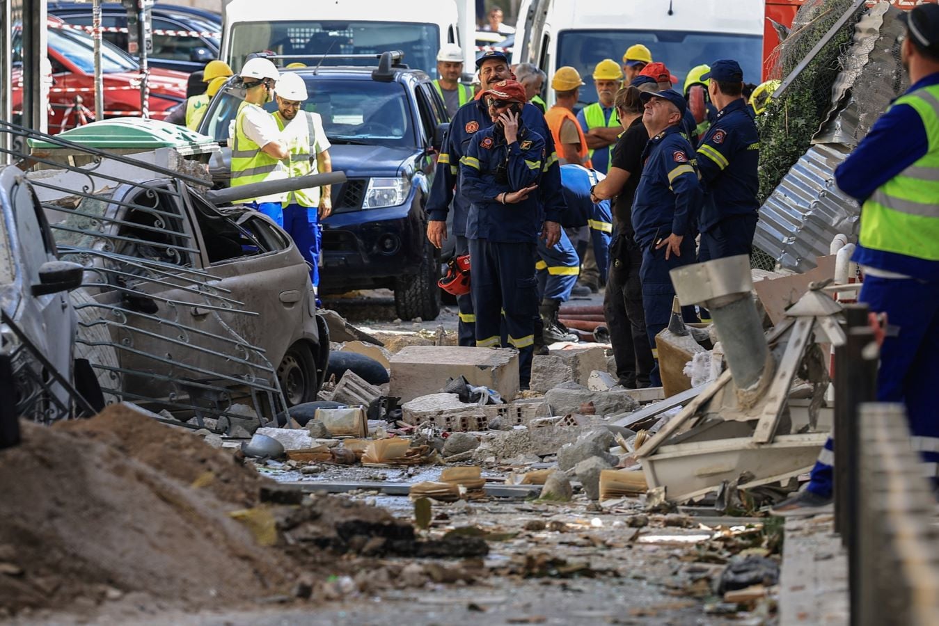Members of emergency personnel work at the site where an old building collapsed following an explosion, in the Plaka area, which is popular with tourists, in central Athens, Greece, September 25, 2026. REUTER