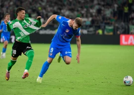 atletico madrid s alexander sorloth r tussles with real betis defender nelson deossa during the spanish league match at the cartuja stadium in seville on october 27 2025 photo afp