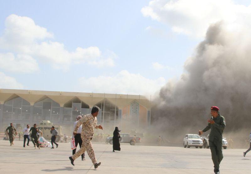 security personnel and people react during an attack on aden airport moments after a plane landed carrying a newly formed cabinet for government held parts of yemen in aden yemen december 30 2020 photo reuters