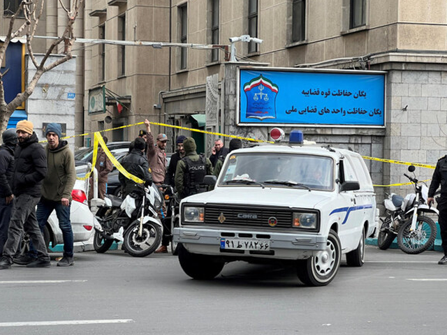 members of the police stand in front of the judiciary building after the assassination of the supreme court judges mohammad moghiseh and ali razini in tehran iran on jan 18 photo reuters