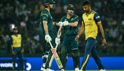 australia s captain mitchell marsh l and travis head c bump their fists during the 2026 icc men s t20 cricket world cup group stage match between australia and sri lanka at pallekele international cricket stadium in kandy on february 16 2026 photo afp