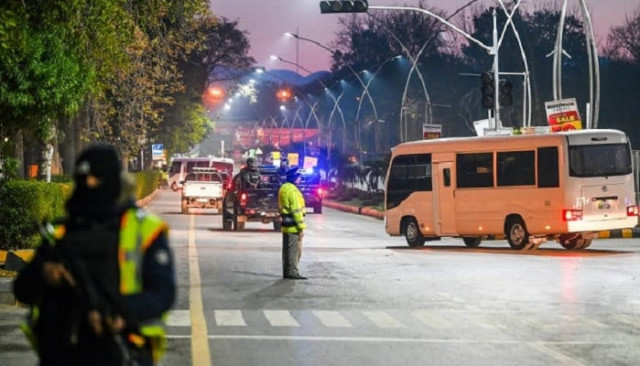a convoy carrying the australian team is flanked by heavy security in islamabad afp a convoy carrying the australian team is flanked by heavy security in islamabad afp