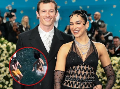 dua lipa and callum turner show pda during romantic swim on amalfi coast