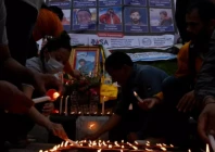 mourners in kathmandu lit candles before the portraits of mountaineer nirmal purja and his companions who were killed in an avalanche in pakistan photo afp file