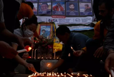 mourners in kathmandu lit candles before the portraits of mountaineer nirmal purja and his companions who were killed in an avalanche in pakistan photo afp file