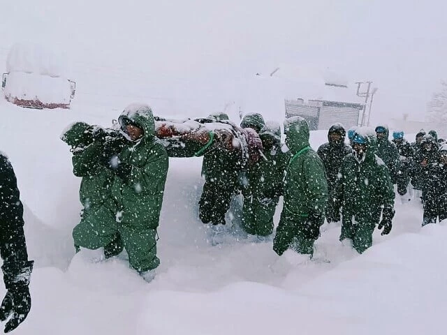 in this handout photo taken and released by the state disaster response force on february 28 rescuers carry border roads organisation workers after an avalanche near mana village in uttarakhand s chamoli district photo afp in this handout photo taken and released by the state disaster response force on february 28 rescuers carry border roads organisation workers after an avalanche near mana village in uttarakhand s chamoli district photo afp