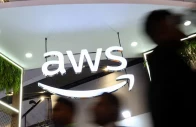 people walk past the logo of amazon web services aws at its exhibitor stall at the india mobile congress 2025 at yashobhoomi a convention and expo center in new delhi india october 8 2025 photo reuters
