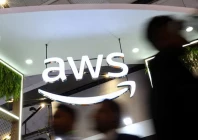 people walk past the logo of amazon web services aws at its exhibitor stall at the india mobile congress 2025 at yashobhoomi a convention and expo center in new delhi india october 8 2025 photo reuters people walk past the logo of amazon web services aws at its exhibitor stall at the india mobile congress 2025 at yashobhoomi a convention and expo center in new delhi india october 8 2025 photo reuters