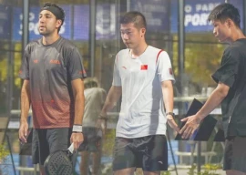 pakistan s aziz khan left is seen with his partner sebastien garcia ortega from belgium after winning the final round in fip international bronze tournament in hong kong photo ppf