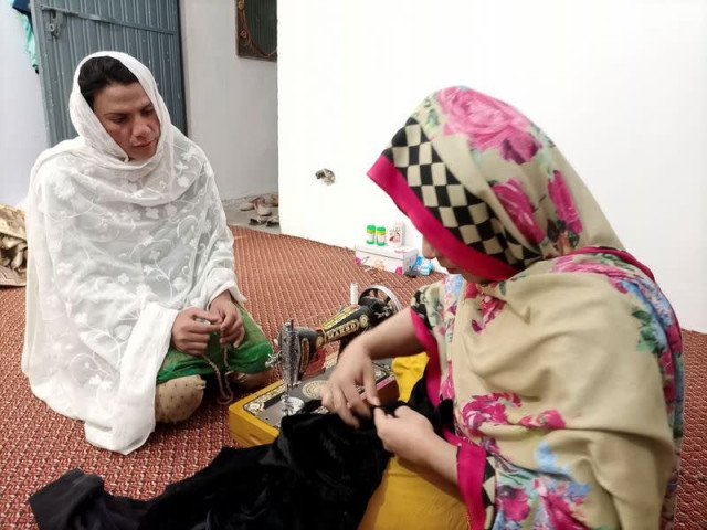 rani khan a trans woman who teaches the quran at pakistan s first trans person only madrasa looks at one of her students during a tailoring lesson in islamabad pakistan march 10 2021 photo reuters
