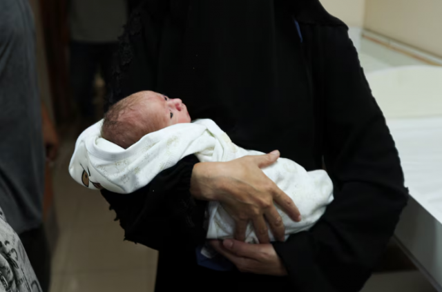 palestinian baby malek yassin who was saved from the womb of his mother ola al kurd who was killed in an israeli strike according to medics amid the ongoing israel hamas conflict lies in an incubator at a hospital in central gaza strip july 20 2024 photo reuters palestinian baby malek yassin who was saved from the womb of his mother ola al kurd who was killed in an israeli strike according to medics amid the ongoing israel hamas conflict lies in an incubator at a hospital in central gaza strip july 20 2024 photo reuters