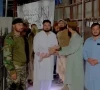 father holds his five month old baby after crossing into pakistan via the torkham border for medical treatment photo express