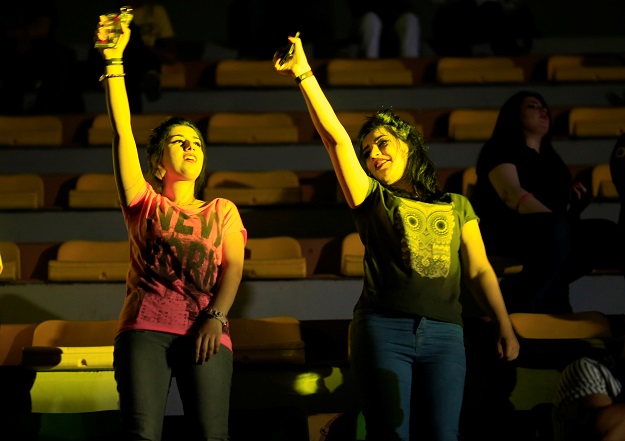 Young women dancing in the concert in Baghdad. PHOTO: REUTERS