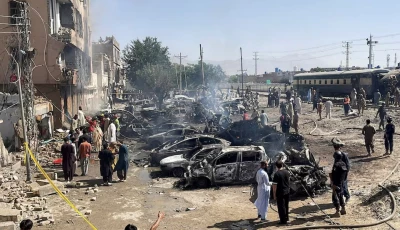 people and police officers gather after a blast near a railway track in quetta pakistan may 24 2026 picture taken with a mobile phone reuters stringer