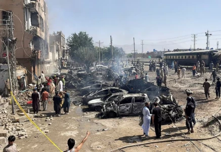 people and police officers gather after a blast near a railway track in quetta pakistan may 24 2026 picture taken with a mobile phone reuters stringer