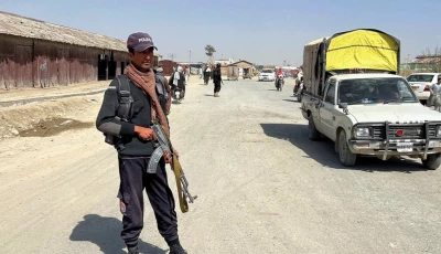 a police officer stands guard along a road leading to the border crossing along the pakistan afghanistan in balochistan province in chaman on february 27 2026 photo reuters
