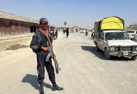 a police officer stands guard along a road leading to the border crossing along the pakistan afghanistan in balochistan province in chaman on february 27 2026 photo reuters