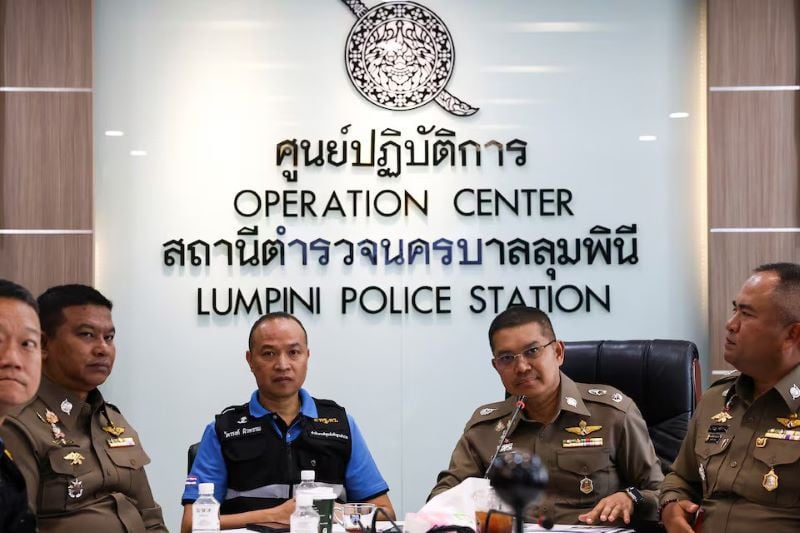 deputy commissioner of the metropolitan police bureau police major general noppasin poonsawat and chief of the police forensic science office police lieutenant general trairong phiwpan react during a presser following a case of six foreign nationals who were found dead inside a room at grand hyatt hotel photo reuters