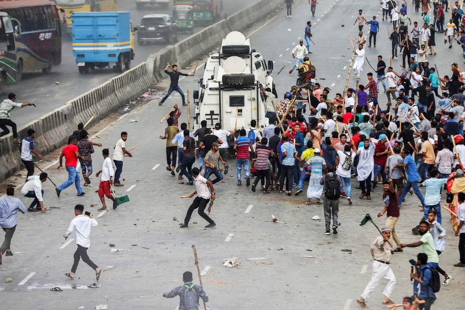 supporters of the bangladesh nationalist party bnp attack armed vehicles of police at shonir akhra area during their sit in rallies on the main entry points of the capital dhaka bangladesh july 29 2023 photo reuters