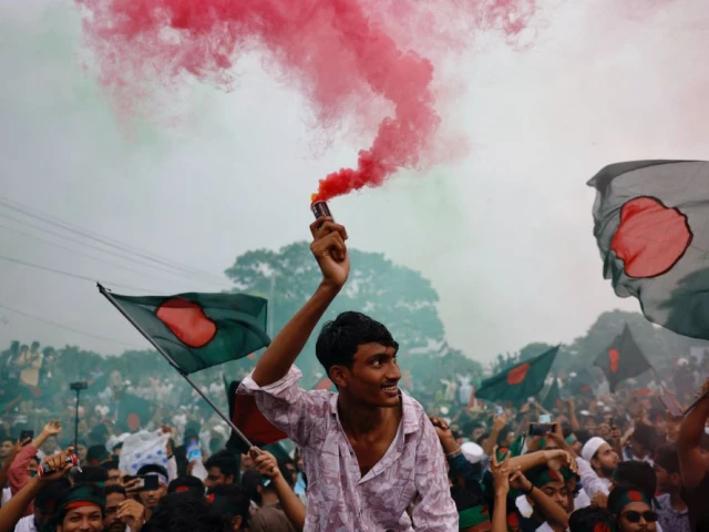 people use coloured smoke and wave flags as they celebrate the one year anniversary since student led protests ousted bangladesh s former prime minister sheikh hasina at manik mia avenue outside of the parliament building in dhaka bangladesh august 5 2025 photo reuters people use coloured smoke and wave flags as they celebrate the one year anniversary since student led protests ousted bangladesh s former prime minister sheikh hasina at manik mia avenue outside of the parliament building in dhaka bangladesh august 5 2025 photo reuters