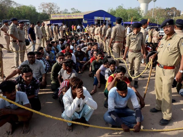 police officers stand next to men they believe to be undocumented bangladeshi nationals after they were detained during raids in ahmedabad india april 26 2025 photo reuters police officers stand next to men they believe to be undocumented bangladeshi nationals after they were detained during raids in ahmedabad india april 26 2025 photo reuters