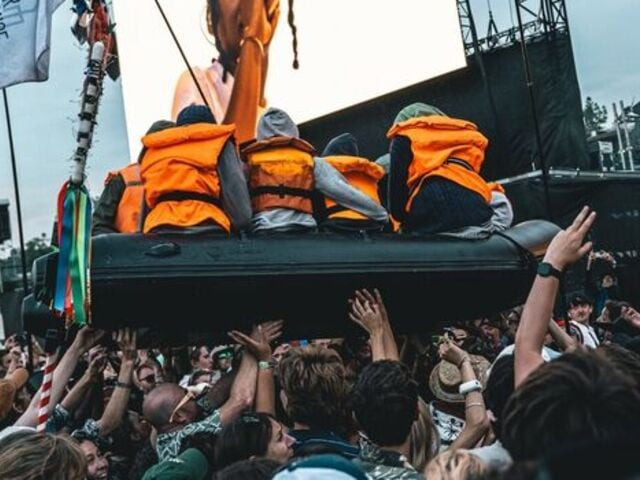 banksy stages controversial refugee boat stunt at glastonbury banksy stages controversial refugee boat stunt at glastonbury