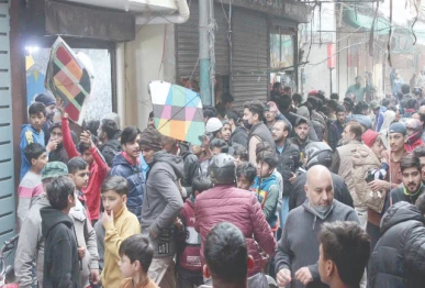 residents converge in a street in the old city area to buy kites and strings for basant sunday was the first day of permitted sale of the items for the festival scheduled from february 6 to 8 photo nni