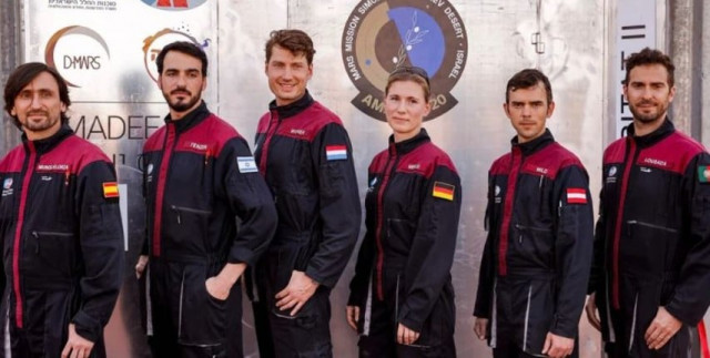 a team of six astronauts from l to r spain israel the netherlands germany austria and portugal pose for a group photo before starting a training mission for planet mars at a site that simulates an off site station at the ramon crater in mitzpe ramon in israel s southern negev desert on october 10 2021 photo afp a team of six astronauts from l to r spain israel the netherlands germany austria and portugal pose for a group photo before starting a training mission for planet mars at a site that simulates an off site station at the ramon crater in mitzpe ramon in israel s southern negev desert on october 10 2021 photo afp