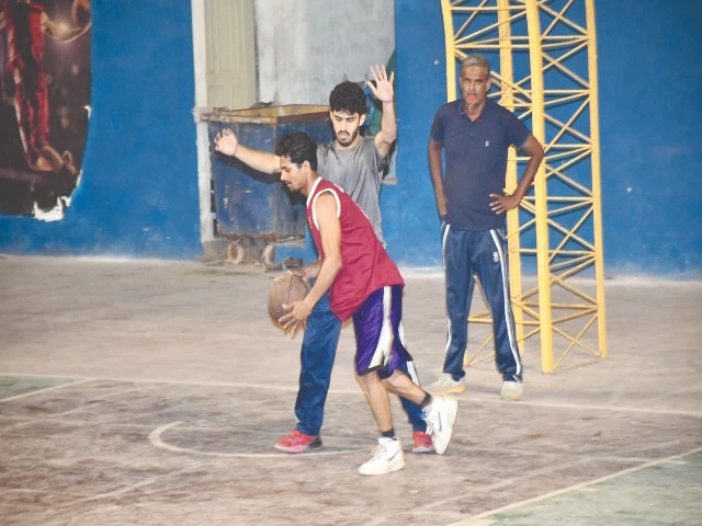 players in action during a basketball match in slice cup at arambagh on thursday night photo kba players in action during a basketball match in slice cup at arambagh on thursday night photo kba