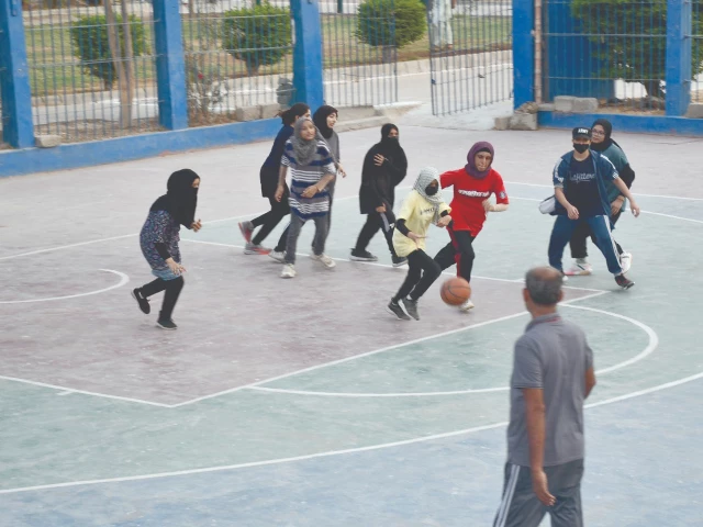 a view of the girls basketball match during the shuhada e traffic police trophy being held at the international abdul nasir basketball court in aram bagh photo app